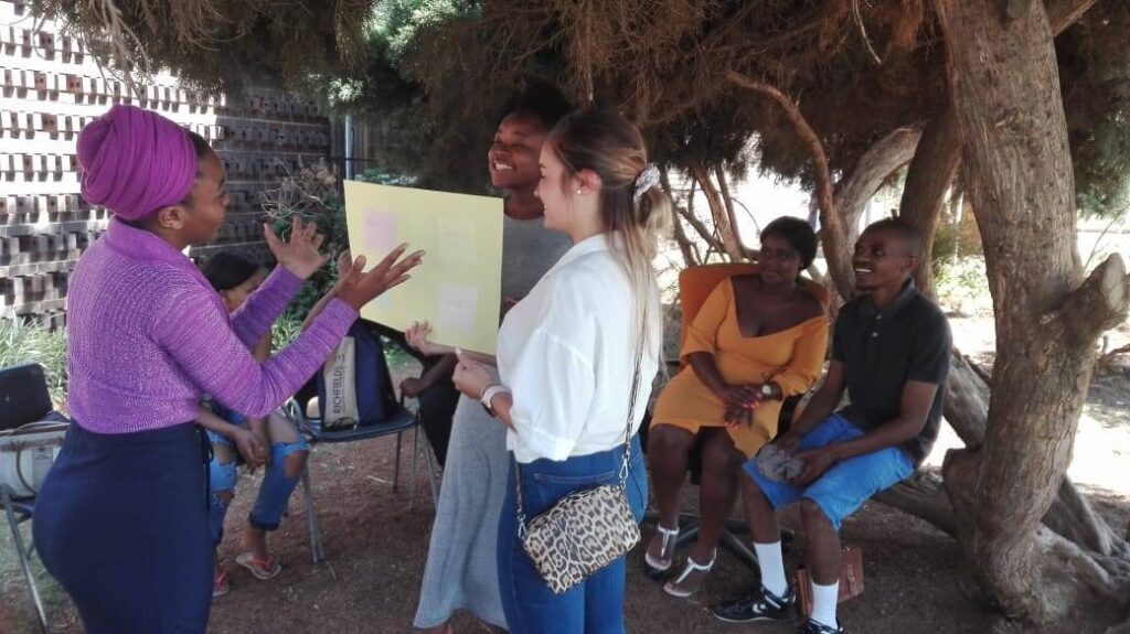 3rd year psychology student from university of pretoria facilitating the theme conflict resolution to our beneficiaries (1)